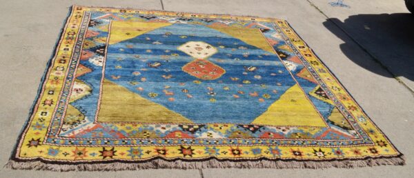 <a class="more-link" href="https://dingo.gallery/product/persian-gabbeh-square-qashqai-or-luri-blues-and-yellow-7-ft-5-in-by-7-ft-5-in/">Continue Reading →</a> Blue luri Qashqai Gabbeh yellow rug